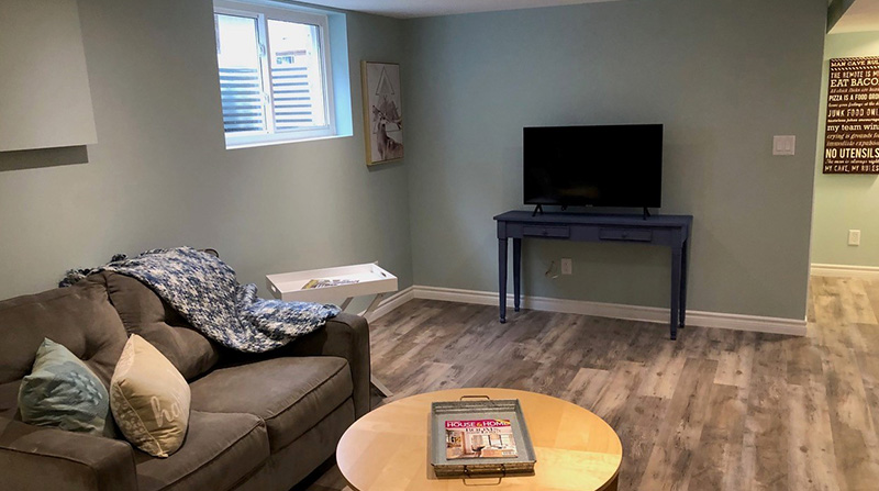 Basement with hardwood flooring