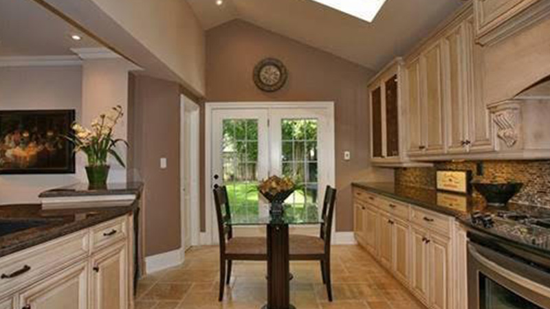 Kitchen with vaulted ceiling and skylights