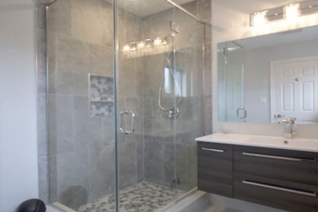 Floating vanity in bathroom with glass shower