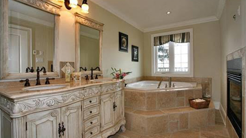 bathroom with jacuzzi and fireplace