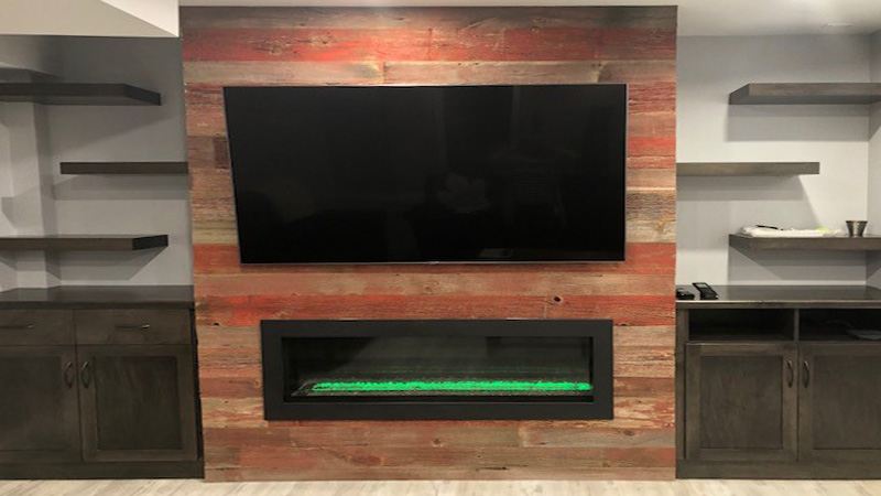 wall-mounted tv over a fireplace